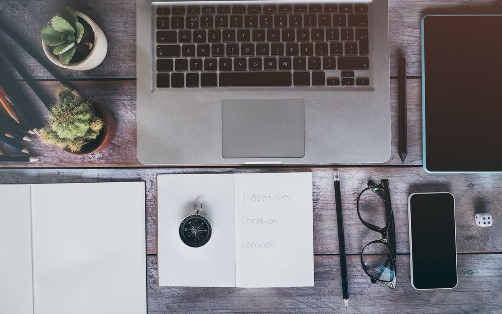 Desk with laptop and notebooks