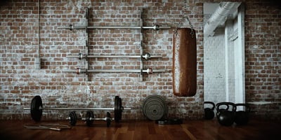 Old-fashioned gym with weights and bars