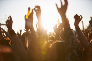 strengthen brand value: fans with arms in the air