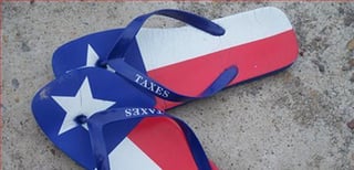 Sandles in Texas colour scheme that say 'taxes' instead